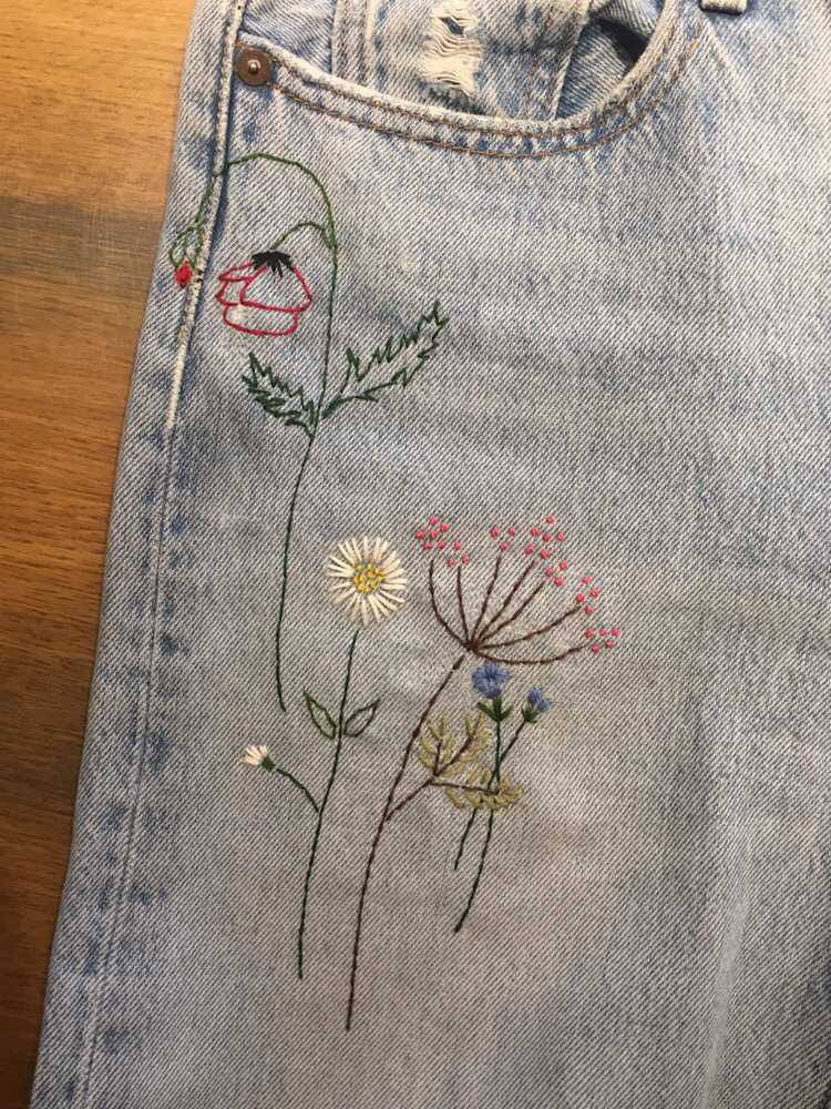 Camouflage a stain on your pants with embroidery.
