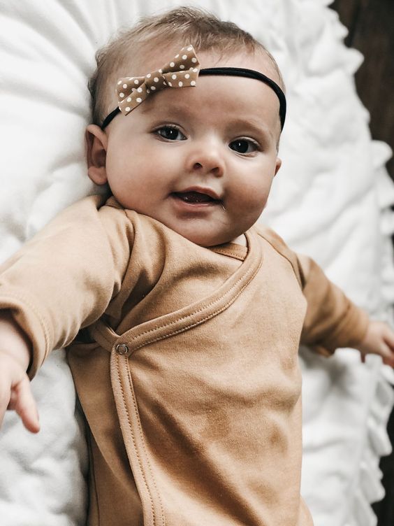 Baby with elastic headband and bow