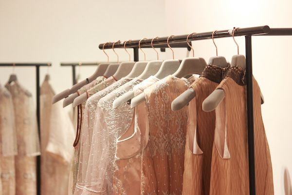 Clothes hanging on hangers on a rack