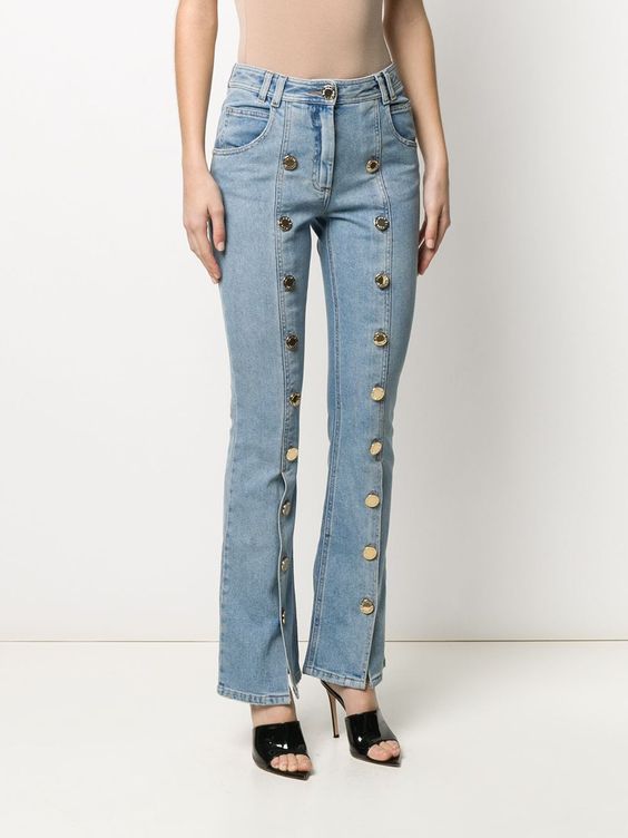 Jeans trimmed with buttons all down the legs